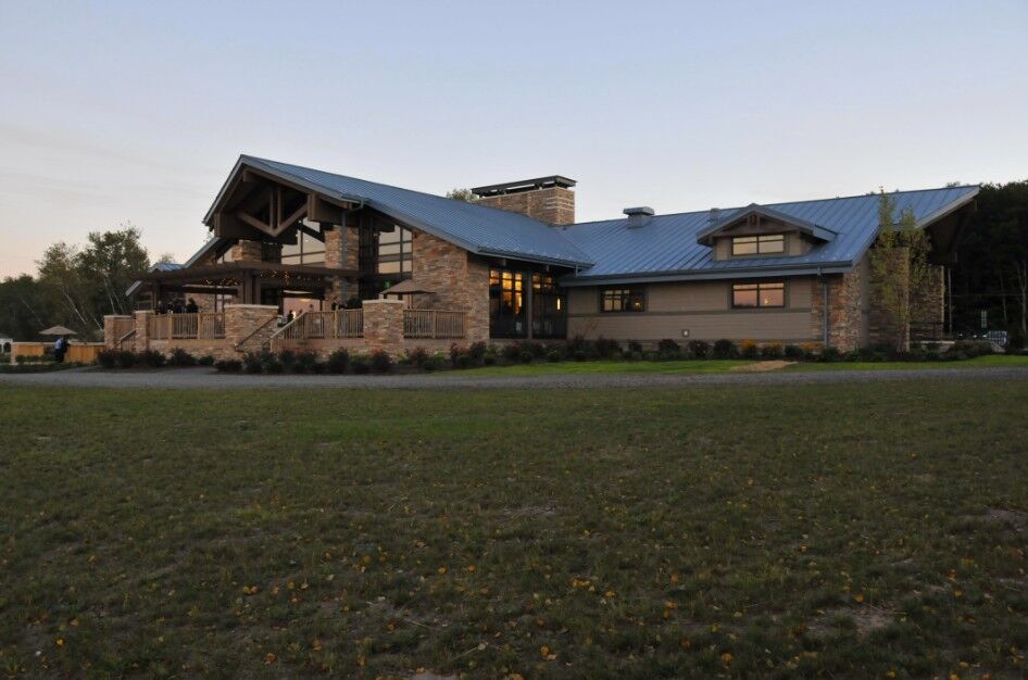 Arrowhead Lake clubhouse exterior at dusk